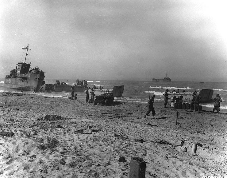 Landing scene on Red Beach at Gela, Sicily, 10 Jul 1943; note LCI(L)-220 at left, a LCM from USS Bellatrix, two LCVPs, and a jeep