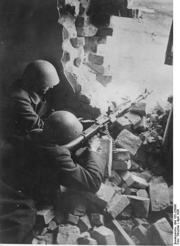 German Volkssturm troops with a MG 34 machine gun in a ruined building in Silesia, Germany (now Poland), Apr 1945