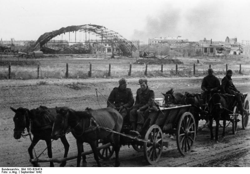 German troops on horse carriages near a destroyed Russian airfield, Stalingrad, Russia, Sep 1942