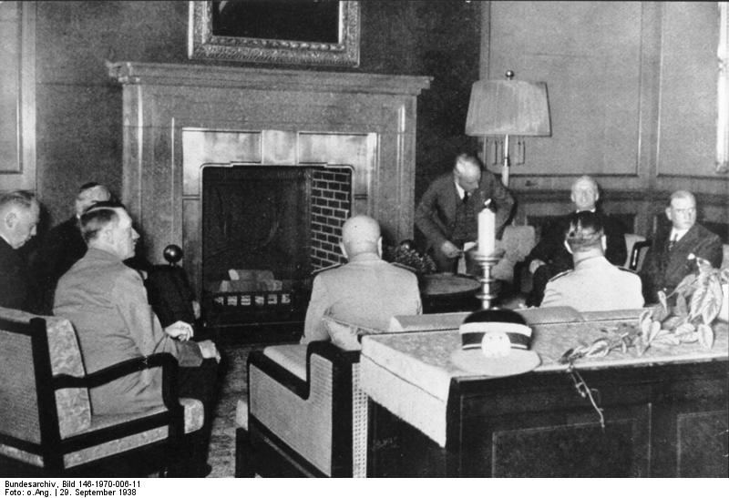 Chamberlain (covered by Hitler), Hitler, Mussolini, and Daladier negotiating at the Munich Conference, Germany, 29 Sep 1938, photo 1 of 2