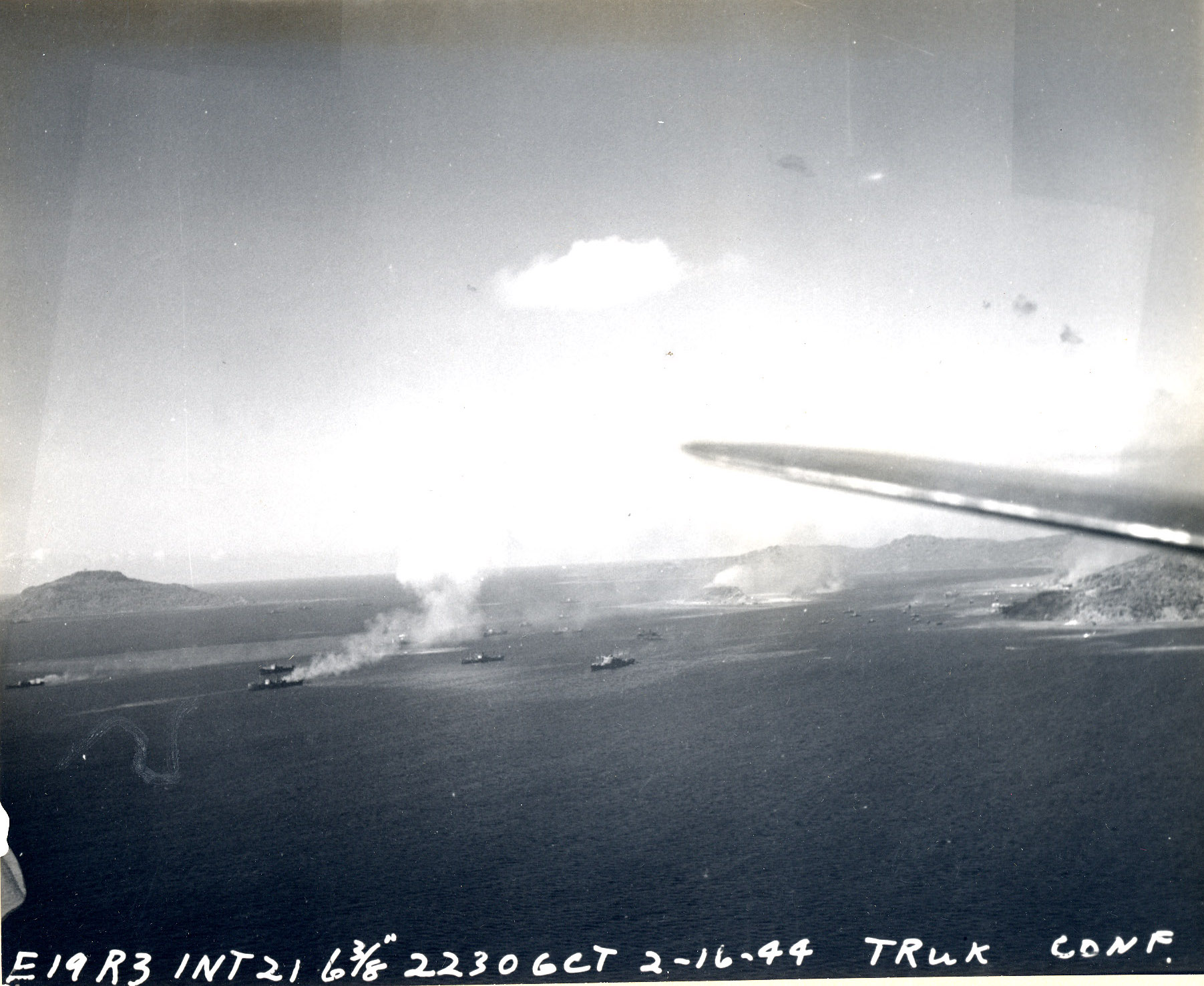 Japanese ammunition ships in Truk Harbor being attacked by dive bombers of USS Intrepid, Caroline Islands, 17 Feb 1944
