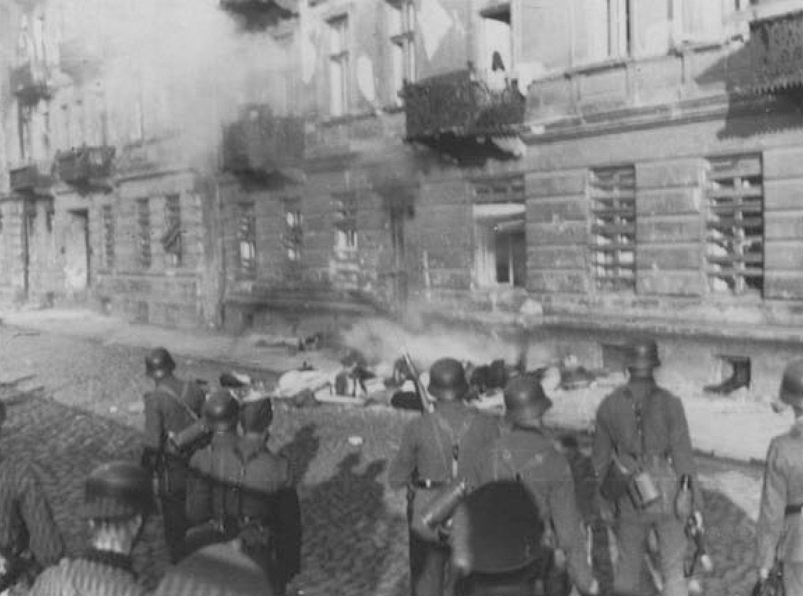 Jewish man committing suicide by jumping off the top story window of the building at 23 and 25 Niska Street during the Warsaw Ghetto Uprising, Poland, Apr-May 1943, photo 2 of 2