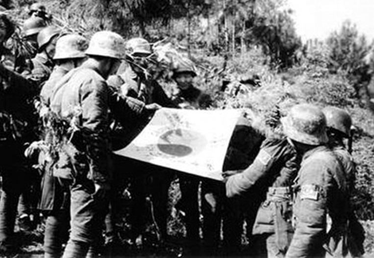 Chinese troops with a captured Japanese flag, Kunlun Pass, Guangxi, China, 31 Dec 1939