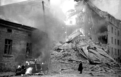 A building in Helsinki, Finland on fire from aerial bombing, 30 Nov 1939