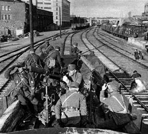 Finnish troops posing with anti-aircraft machine guns at a railyard in Helsinki, Finland, 13 Oct 1939