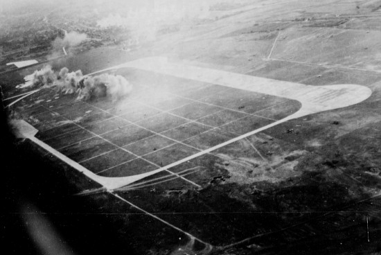 Heito Airfield under attack by aircraft of squadron VB-80 from USS Ticonderoga, southern Taiwan, 9 Jan 1945, photo 2 of 3