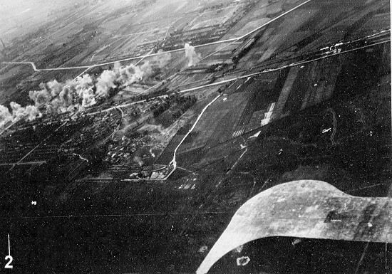 Aircraft of squadron VB-80 from USS Ticonderoga attacking the railroad south of Heito Airfield, southern Taiwan, 9 Jan 1945
