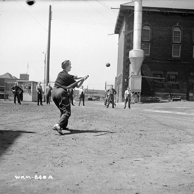 Veronica 'Ronnie' Foster playing softball outside the John Inglis and Company factory, Toronto, Canada, 1940s