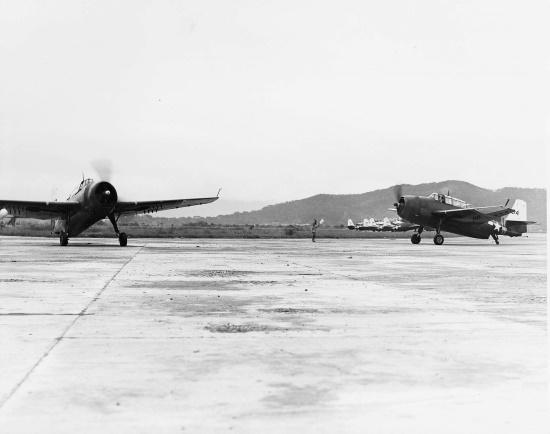 Two TBM-3 aircraft of US Navy squadron VT-26 at Matsuyama Airfield, Taihoku (now Taipei), Taiwan, early Sep 1945