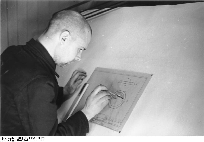 Soviet prisoner of war working on a technical drawing at Peenemünde Army Research Center, Germany, 1940s