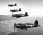 F4U-1D Corsair fighters fly in formation over Hawaii, Jan 1945. Photo 2 of 2.