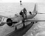OS2U Kingfisher being hoisted aboard a ship, 1943-45.
