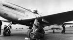 Navy Lt Bob Elder in a P-51D Mustang modified with a tailhook aboard the carrier Shangra-La for testing, 15 Nov 1944.