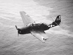 TBM-3 Avenger of VT-82 flying from the carrier Bennington struggles to remain airborne after receiving heavy damage in a mid-air collision with another Avenger over Chi Chi Jima, 18 Feb 1945.
