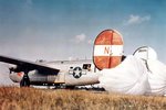 B-24H Liberator “Pegasus The Flying Red Horse” of the 784th Bomb Squadron landing at RAF Attlebridge, Norfolk. The parachutes were used for braking after the hydraulic system was shot out in combat.