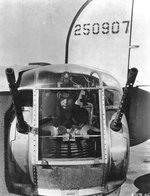Sgt Otto A Sobanjo 755th Bomb Squadron sits in the tail turret of B-24J Liberator “Lily Marlene” at RAF Horsham St Faith, Norfolk, England, UK, Aug 1944.