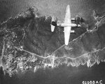 B-26B Marauder of the 441st Bomb Squadron over Île du Levant, France south of St Tropez on raid to bomb gun installations, Aug 4 1944