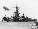 TBF-1 Avengers on the flight deck of USS Ranger while a K-class Airship flies overhead on anti-submarine watch, 1943