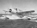 OS2U-2 Kingfisher scout plane plows through the water, 1941