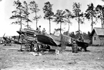 P-40C Tomahawk IIA with the AVG Flying Tigers receiving needed maintenance alongside a Ryan PT-22 Recruit trainer at Kunming, China, Nov 1941-Spring 1942