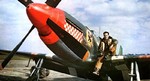 USAAF Capt Don Gentile sits on the wing of his P-51B Mustang “Shangri-La” of the 336th Fighter Squadron at RAF Debden, Essex, England, UK; 1944-45. Photo 1 of 2.
