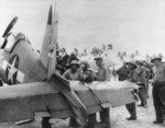 A badly damaged F4U-1A Corsair of Marine Squadron 216 flown by a wounded Lt Robert Marshall managed to return safely to Torokina, Bougainville, Solomons after an encounter with a swarm of A6M Zeros over Rabaul, New Britain, Dec 19 1943. Photo 5 of 5.