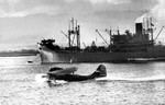 A PBY-5 Catalina taxiing across Pearl Harbor, US Territory of Hawaii, in Feb 1942.  Photo taken from the carrier USS Enterprise.