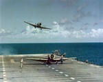 SNJ-5C Texans making carrier landings aboard Light Carrier USS Monterey as part of carrier qualifications, 1953.