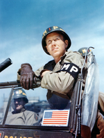 Private Clyde Peacock and the rest of the 1st MP Platoon of the US 1st Army wait in England to board transports to Normandy, early June 1944. The Military Police would be responsible for managing traffic and holding POWs.