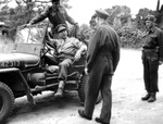 Lt General Henry Crerar, Commander of the 1st Canadian Army, arriving at a public relations camp in France, 1944. The officer of the back is Lt Col RS Malone.