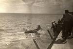 A TBM Avenger after a water landing beside the training aircraft carrier USS Sable on Lake Michigan, United States, 1944-45. Photo 1 of 2.