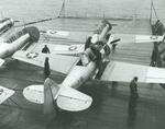 SNJ-3 Texan training aircraft tied to the flight deck aboard the training aircraft carrier USS Wolverine on Lake Michigan, United States, 1942.