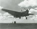 A TBF-1 Avenger with its gear, flaps, and hook down trying to catch the fourth (and last) arresting wire aboard the training aircraft carrier USS Wolverine on Lake Michigan, United States, 17 Aug 1943. Next stop, the barrier.