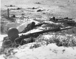 Infantry training in the sand at Bellows Field, Oahu, Hawaii, 1944-45. Note the M1 Garand rifle with M1905 bayonet.