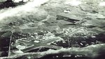 Aerial view of the Ewa Plain lying below the Wai’anae foothills on the south coast of Oahu, Hawaii. Barbers Point Naval Air Station is seen on the left and Ewa Marine Corps Air Station on the right, Jun 9, 1950