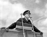 General Dwight D. Eisenhower preparing to make an address at an outdoor podium, 1944. Location unknown.
