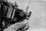 Anti-aircraft gun crews aboard Light Carrier USS Langley roll with the ship in heavy seas in the South China Sea, Jan 18, 1945
