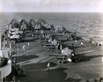 F6F-5 Hellcats of Air Group 11, the “Sundowners,” warm up on the deck of USS Hornet (Essex-class) in the Philippine Sea, late 1944