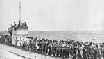 German U-156 with its decks crowded with survivors from the British RMS Laconia prior to the submarine being attacked by an American bomber, Sep 15, 1942.