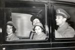 The British Royal family leaving Buckingham Palace to spend Christmas at their country house, Dec 1939. Note King George VI (right), Queen Elizabeth, and the Princesses Elizabeth (left) and Margaret.