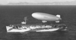 K-class airship K-29 of Airship Patrol Squadron ZP-31 lifts off the flight deck of escort carrier USS Altamaha off the California coast, Feb 24, 1944.