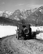 A Jeep from the US Tenth Mountain Division pauses along the road to the Riva Ridge in northern Italy, Feb 1945.