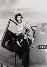 WASP pilot Vivian Eddy in the door of a P-39 Airacobra, 1945. Location unknown.
