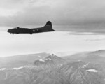 B-17F Fortress flying past Mt. Bagana on Bougainville, Solomon Islands, Nov 11, 1942. This aircraft is returning from bombing Buka Island and is on its way to bomb Shortland Harbor at opposite the end of Bougainville