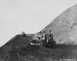 A Bulldozer with the US Marines 32nd Sea Bees cutting a road to the summit of Mt Suribachi, Iwo Jima, Mar 10, 1945.  In 50 years of occupation, the Japanese had never built a road to the top of Suribachi.