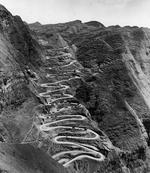 The 24-Turns section of the Kunming-Chungking (Chongqing) Road in China climbs 650 vertical feet using 1.8 miles of road to cover one-quarter of that distance laterally, Guizhou Province, China, 1944, photo 1 of 2