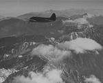 Curtiss C-46 Commando flying over “The Hump” between China, Northern Burma (now Myanmar), and eastern India, 1944.