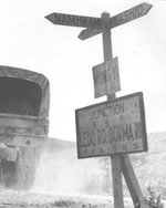 Sign post at Mong Yu, Burma (now Myanmar) at the Chinese border marking the joining of the newer Ledo Road with the previous Burma Road, 1945