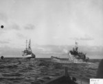 Oceangoing tug USS Abnaki takes the captured Type IXC submarine U-505 under tow, 7 Jun 1944. U-505 was captured three days earlier by the USS Guadalcanal hunter group. Photo 3 of 3.
