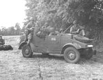 US Army troops in a captured Kübelwagen in France, 1945. Note that the censors have removed the front bumper markings.